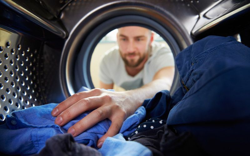 Man washing and taking care of his scrubs.