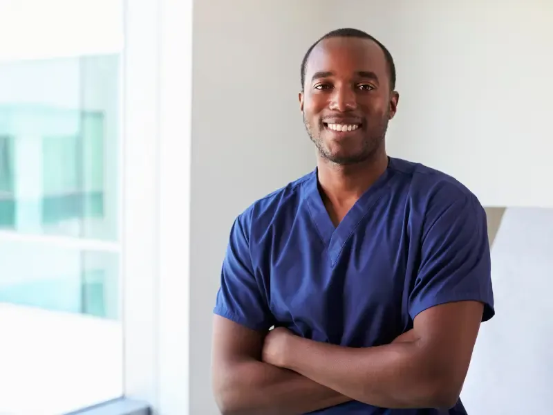 Male nurse in men's scrubs.